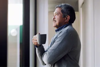 photo of mature man drinking coffee