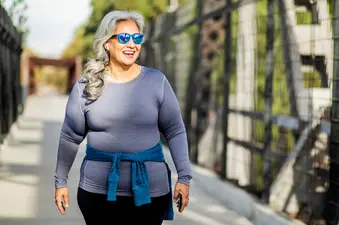 photo of woman walking outside