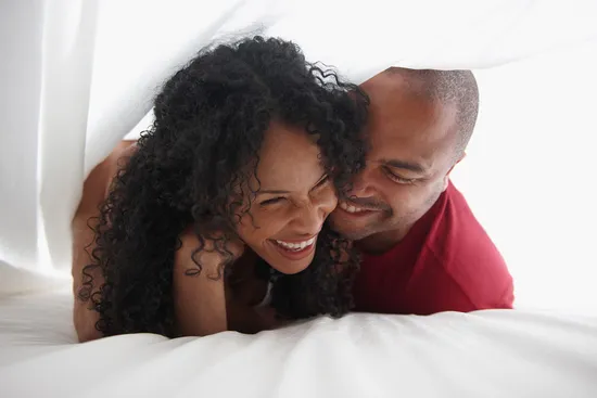 photo of couple in bed