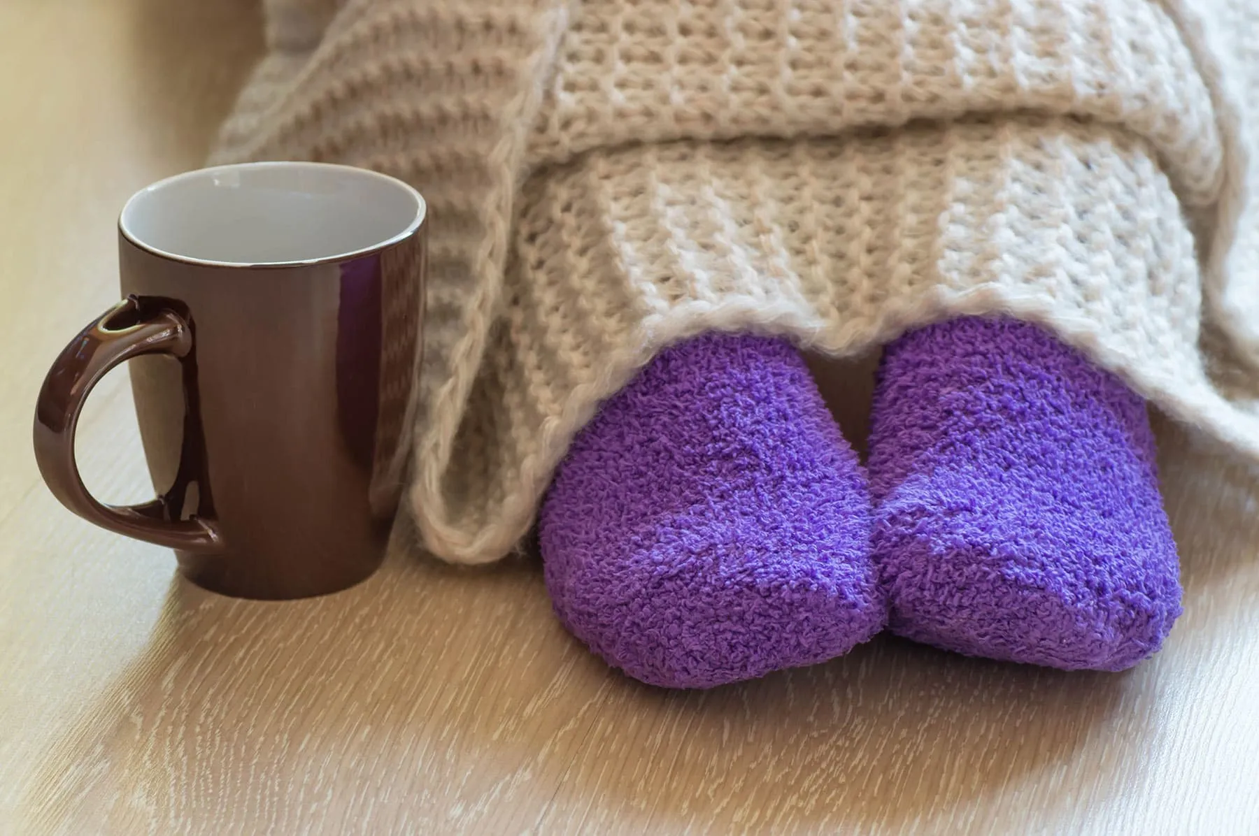 socks blanket and cup of tea