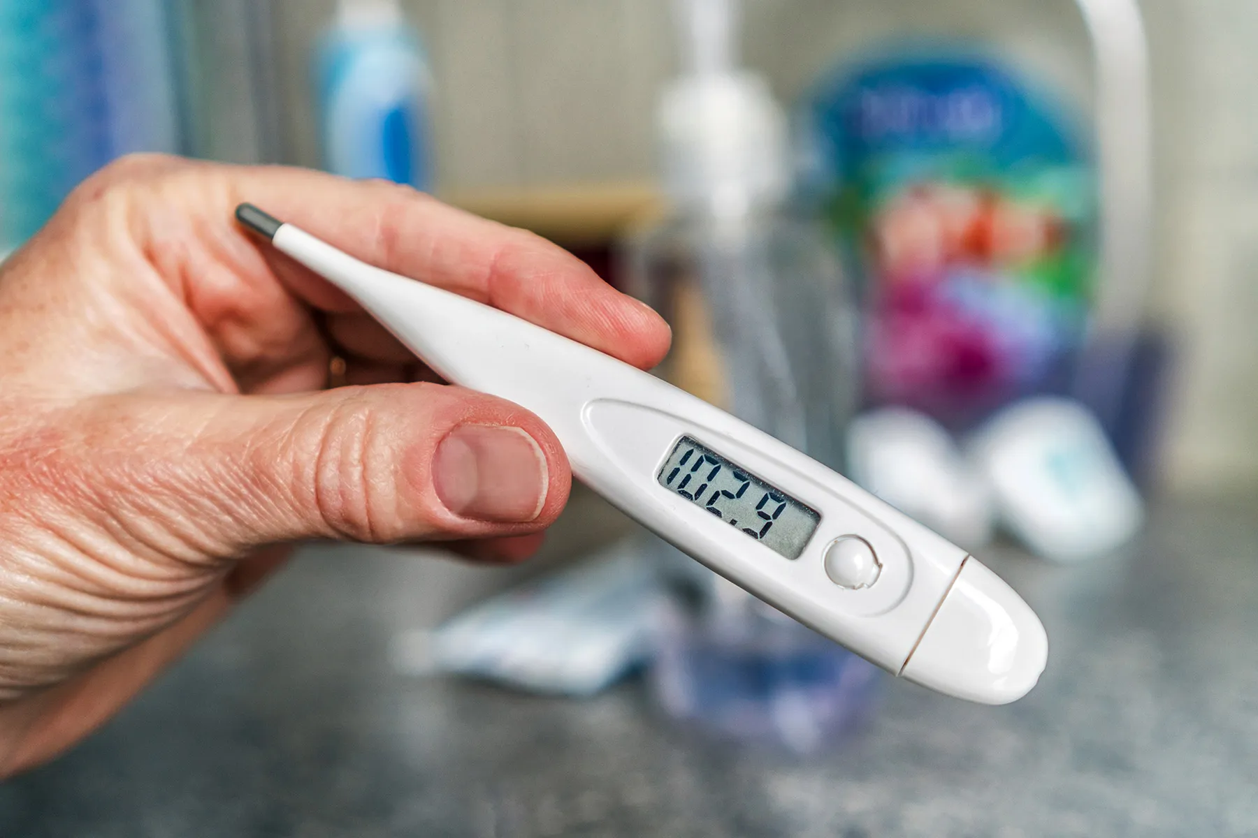 photo of digital thermometer showing 102.9 fever