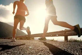 photo of two people running