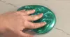 hand playing with slime