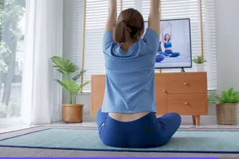 photo of woman stretching at home