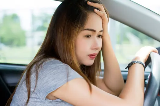 photo of woman stressed in car