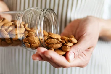 Having a small serving of almonds from time to time can make a big difference. Almonds provide health benefits that include lowering bad cholesterol levels and helping to maintain a healthy weight. (gerenme / Getty Images)