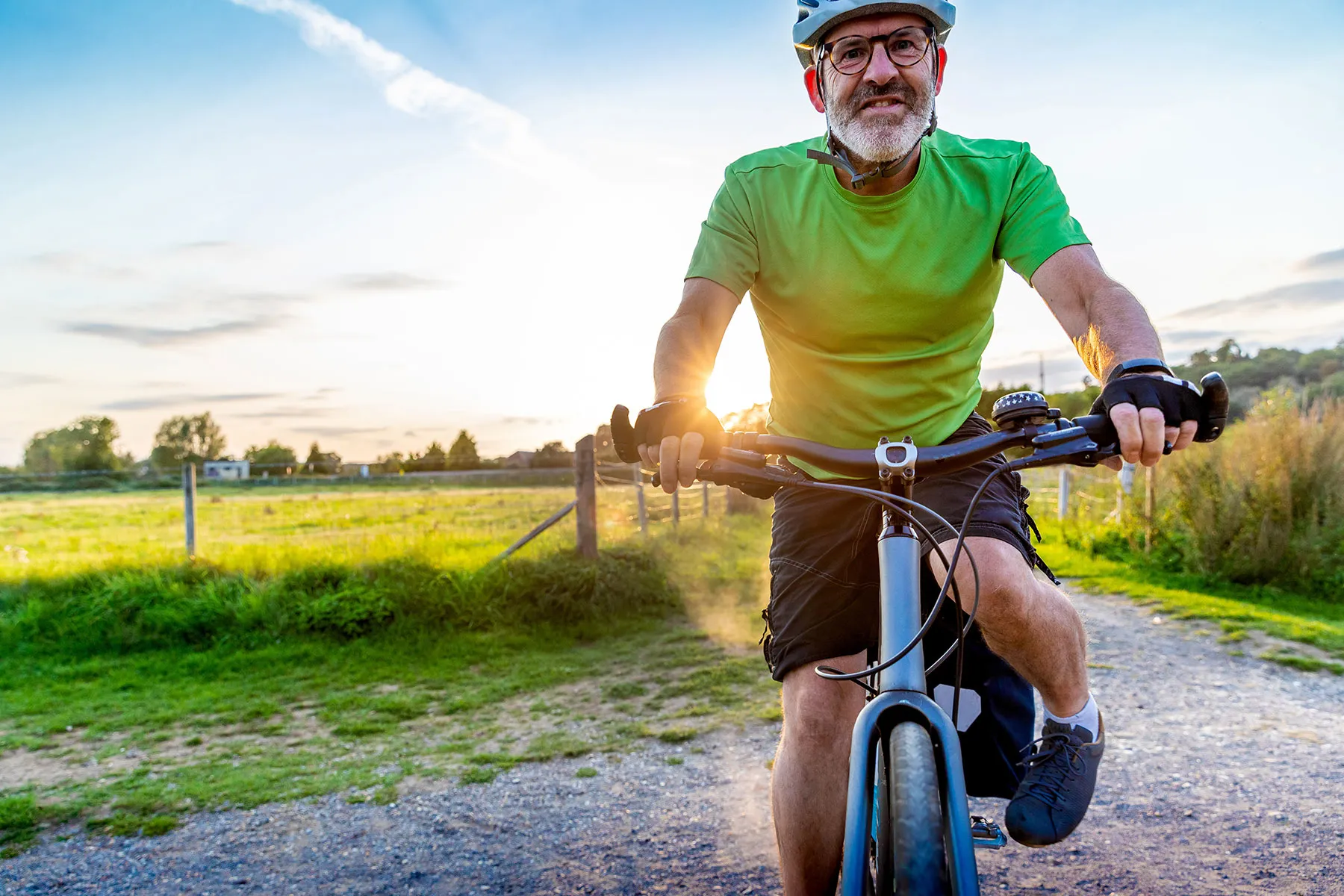 photo of senior man riding trail bike
