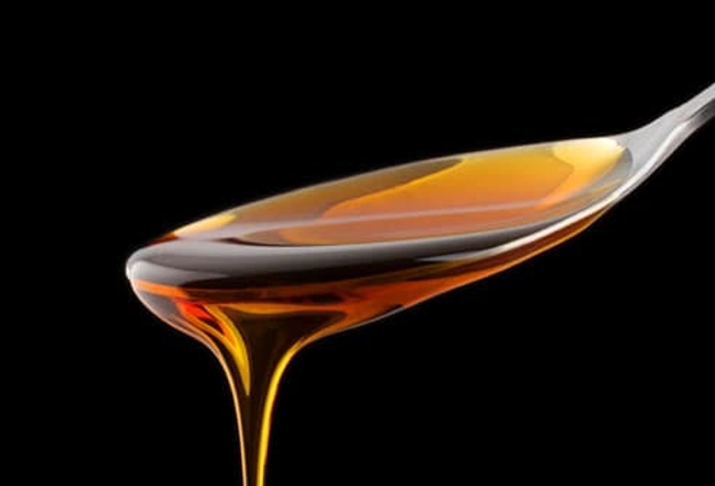 What eases a sore throat and cough?