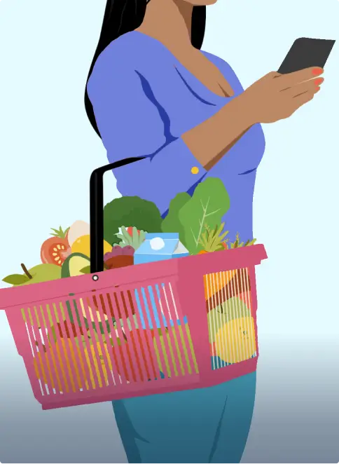 photo of woman holding basket of groceries